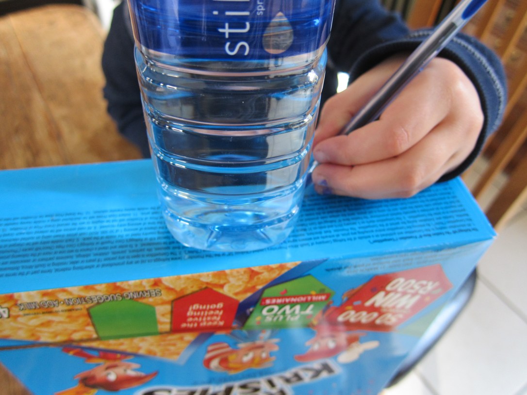 Liter of light kids science project, step 1, draw around your bottle base on top of your box.