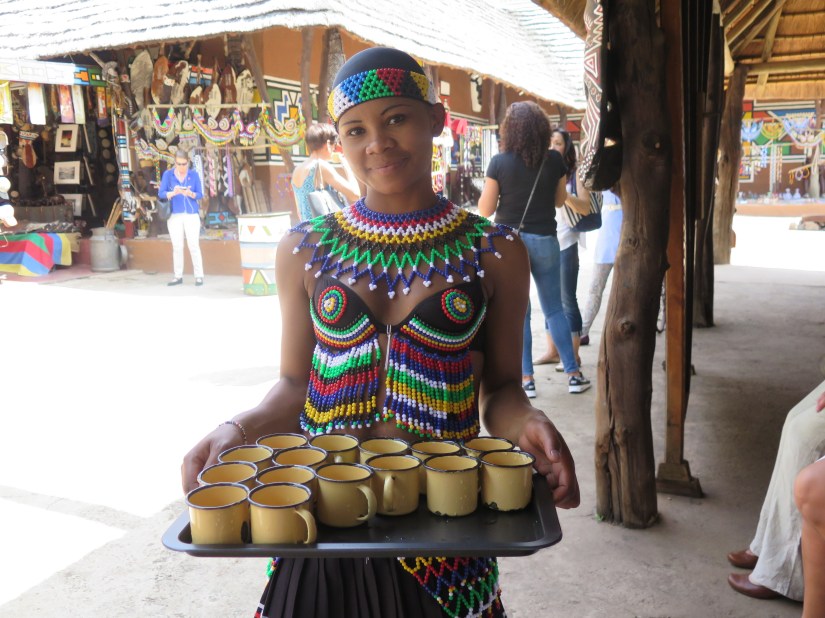 woman in tradtional beaded dress at lesedi cultural village south africa