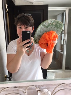 expat life is like fishing a cactus from the wheelie bin, woman holding giant cactus leaf